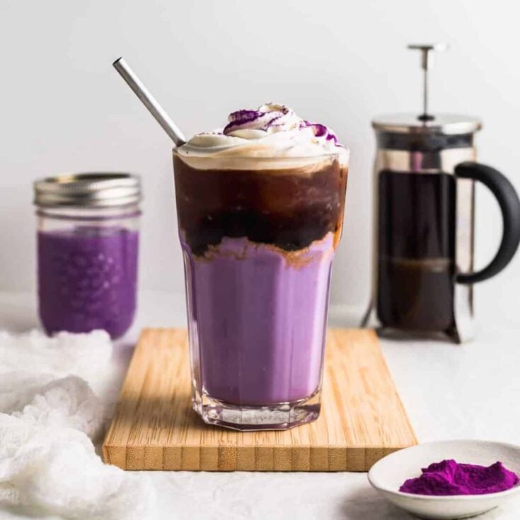 Iced ube latte topped with an ice cream