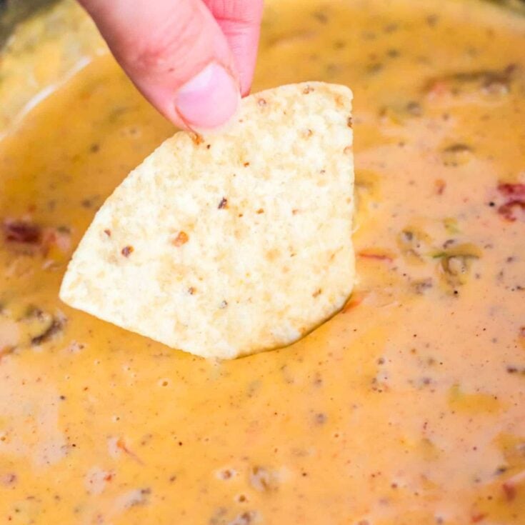 Chip dipped in slow cooker hamburger cheese dip