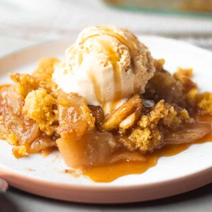 Cake mix apple cobbler dessert topped with ice cream