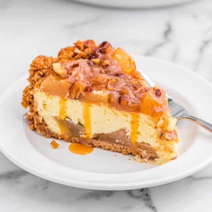 A slice of caramel apple cheesecake dessert