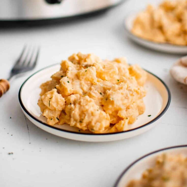 Cheesy crockpot potatoes on a plate