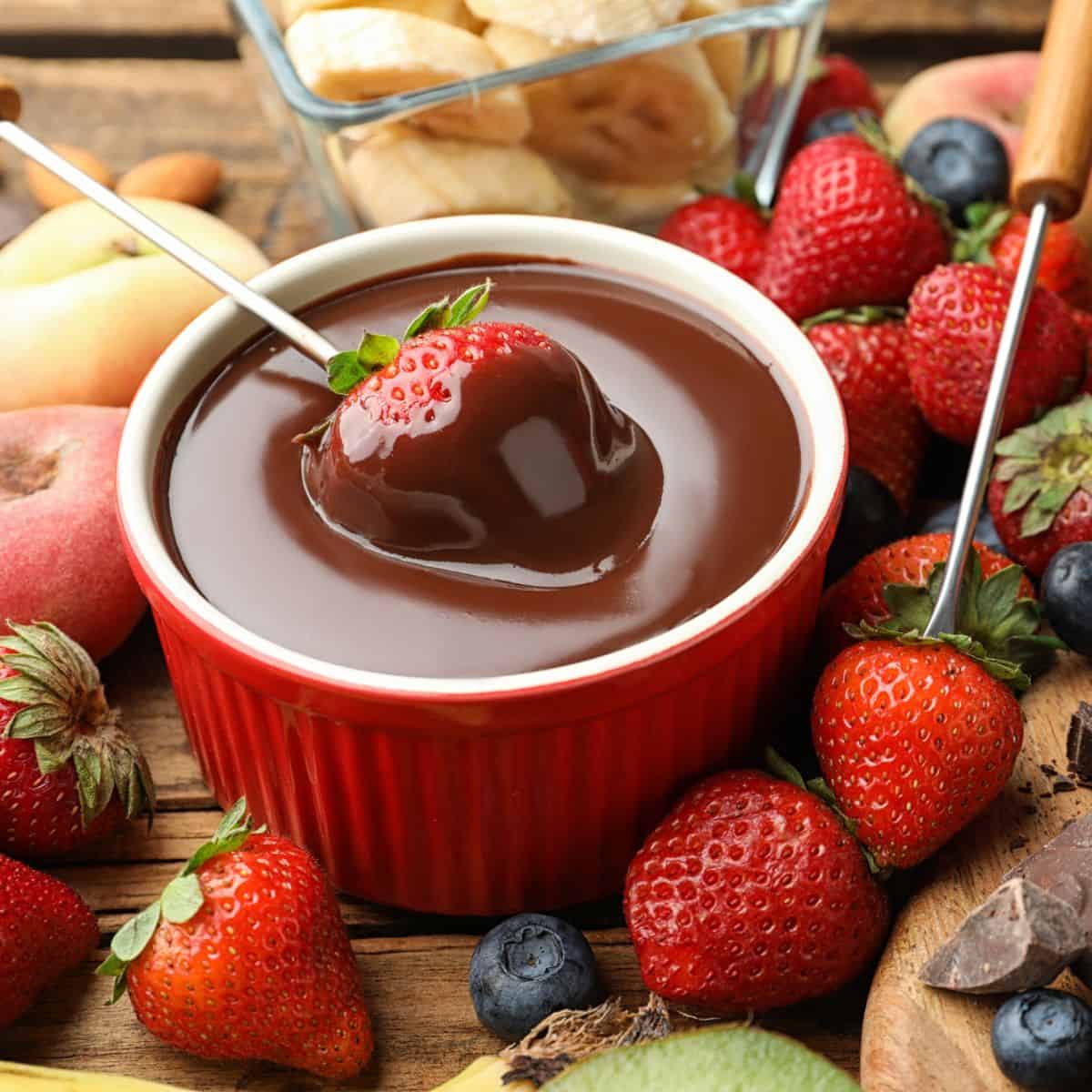 Strawberry dipped in chocolate sauce after reading these dessert dip recipes