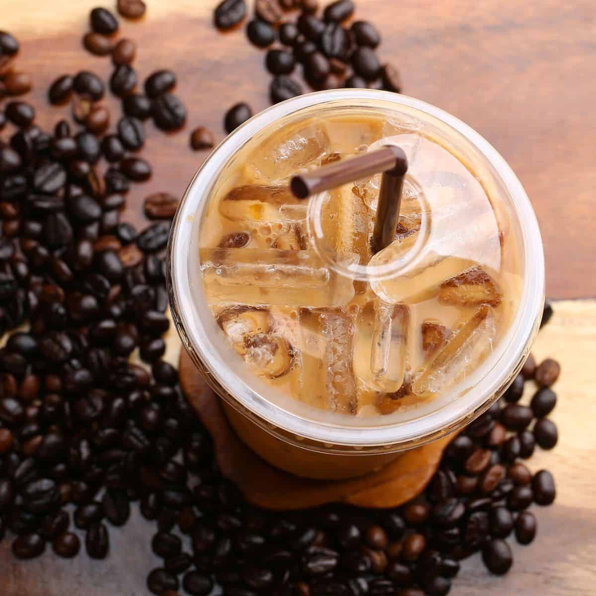An espresso placed on a wooden table, made after reading these iced coffee drinks to make