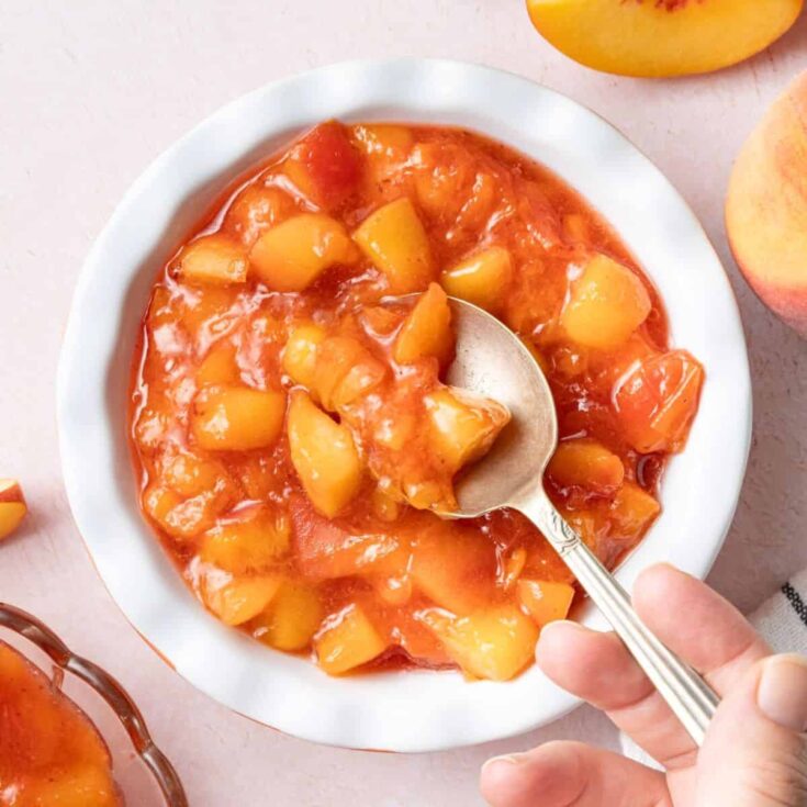 A bowl of peach compote dessert
