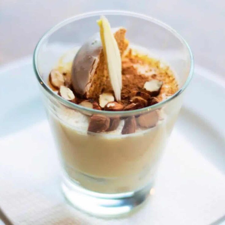 One small glass of white chocolate mousse with gingerbread