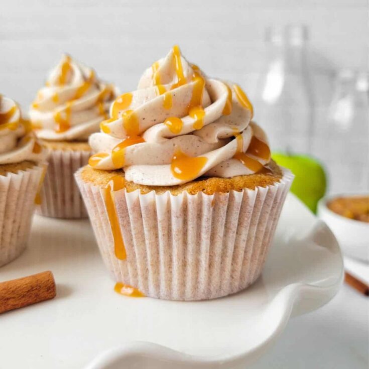 Apple cinnamon cupcakes topped with caramel sauce