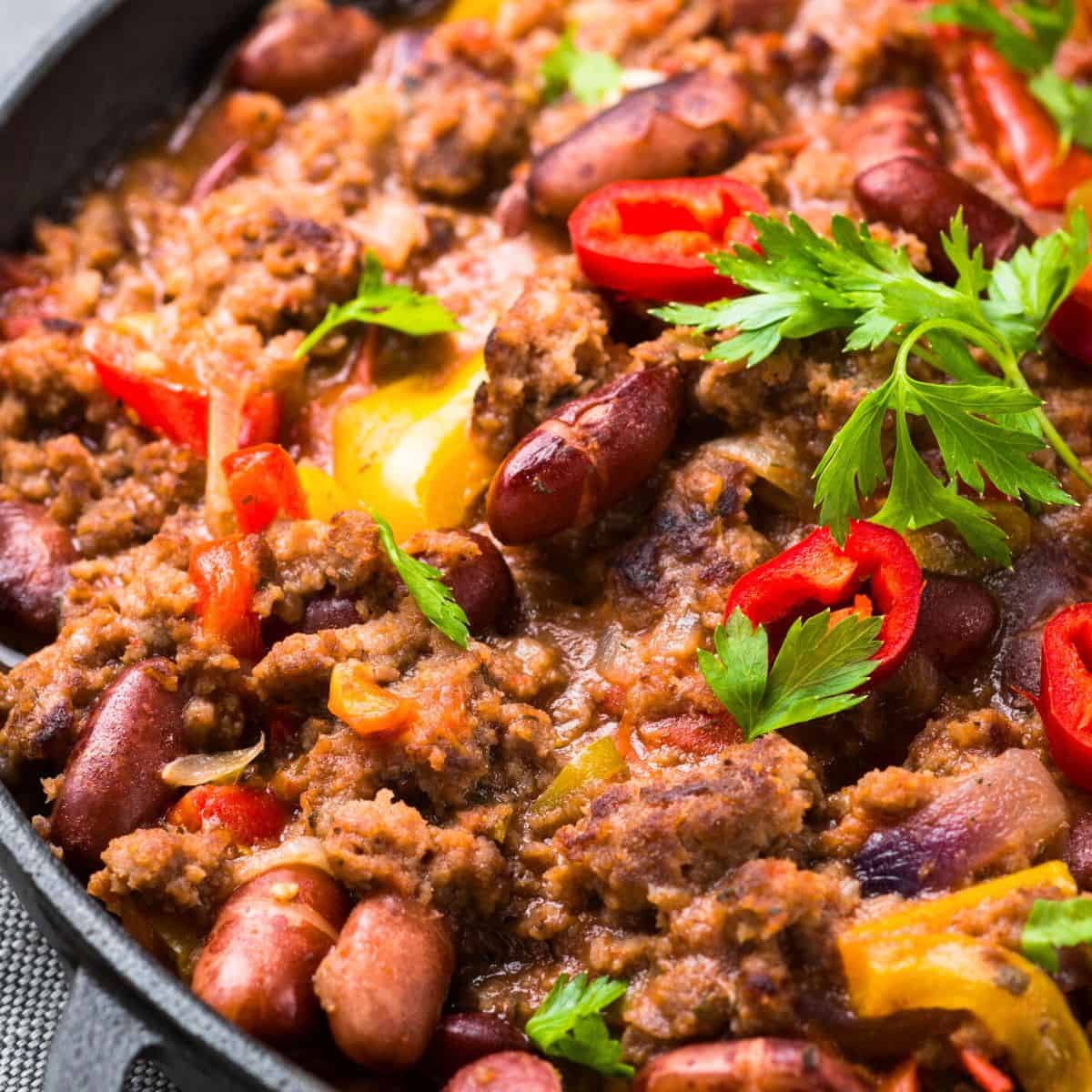 Beef chili dish cooked in a cast-iron skillet, made after readung these Beef chili recipes