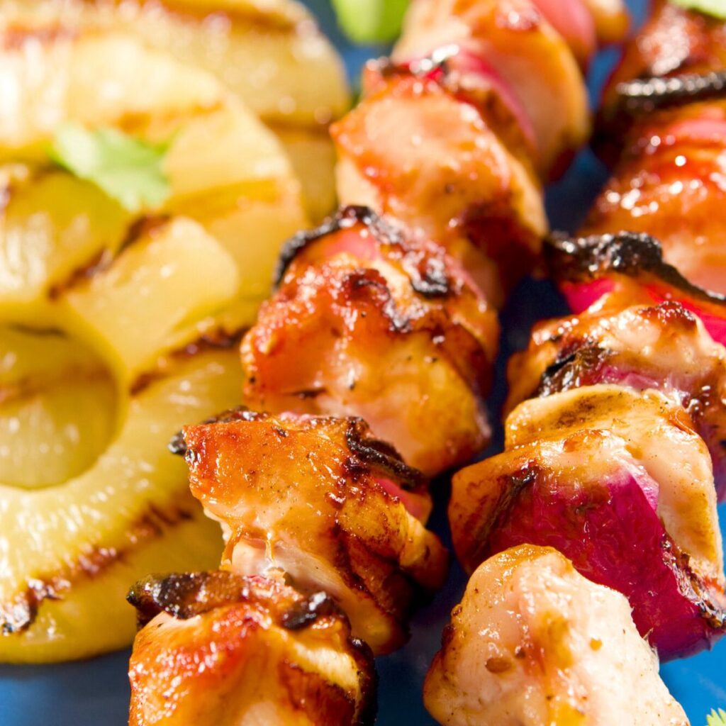 Grilled chicken kebabs with pineapple slices, made after reading these Luau party food recipes