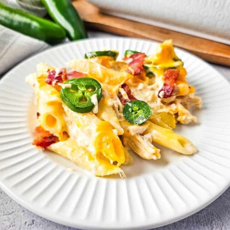 A plate of creamy chicken casserole with bacon Jalapeno popper