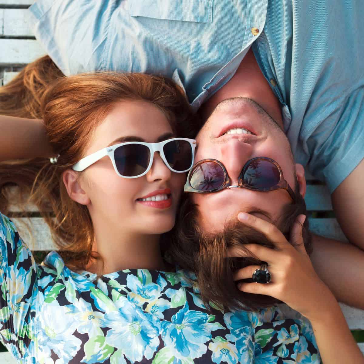 A cute couple looking crazy in love wearing sunglasses. Crazy in love quotes.