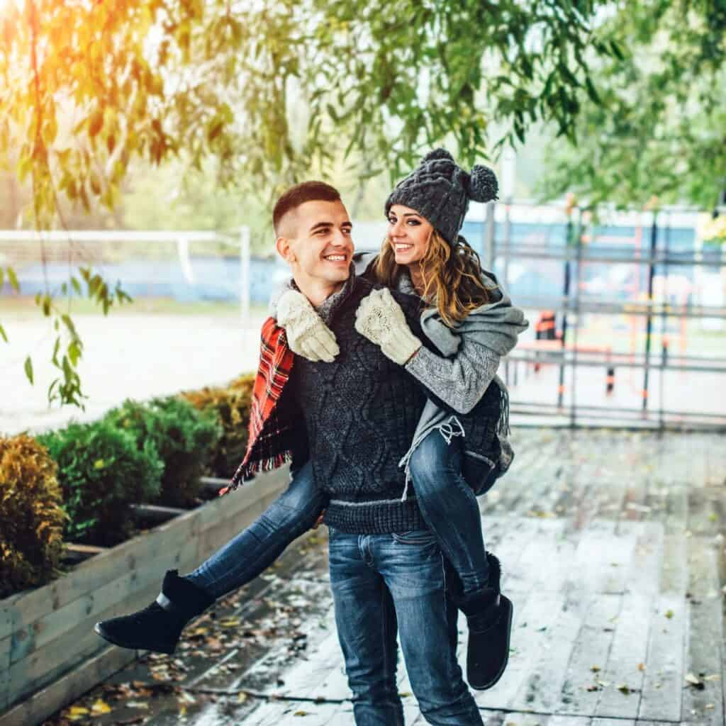 A couple in a piggy back ride