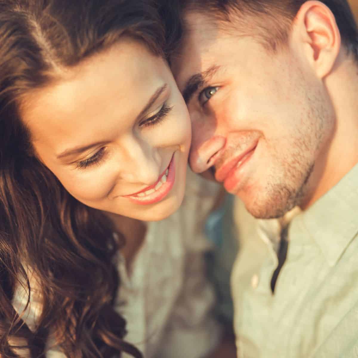 A couple intimately close, with the man looking at the woman lovingly. Love at first sight quotes.