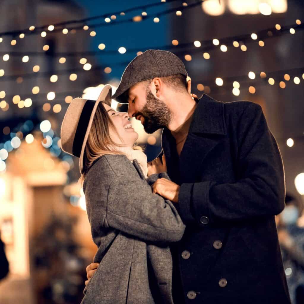 A couple in a flea market, about to kiss