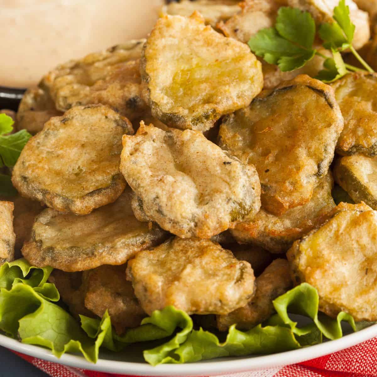 A bowl of crispy fried pickles, made after reading these pickle appetizers