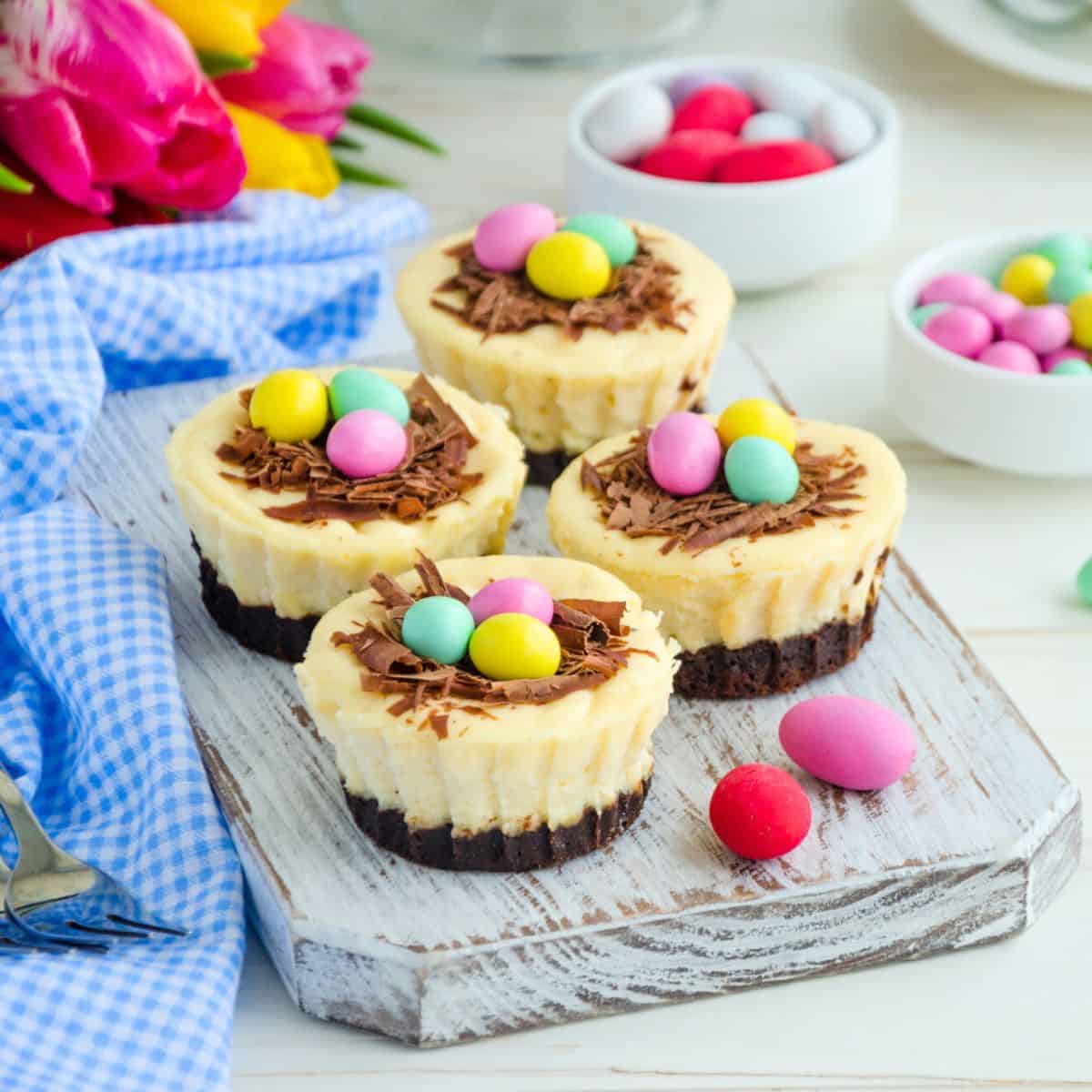 Small cheesecakes topped with small Easter eggs, made after reading these Easter cheesecake ideas