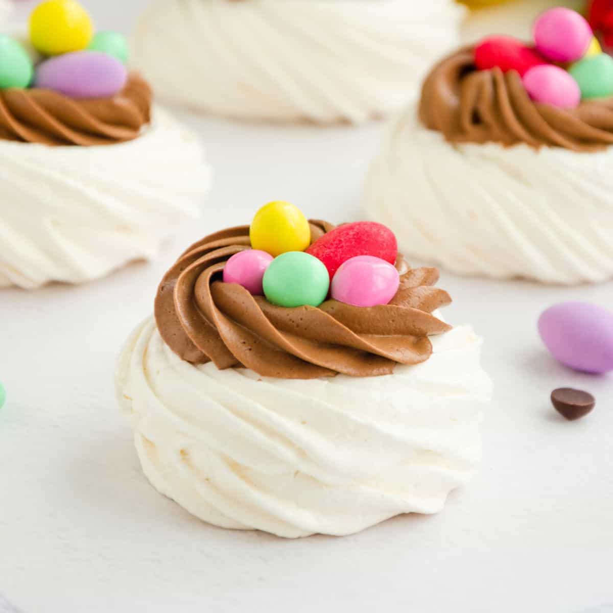 Mini merengue topped with colorful egg-shaped candies, made after reading these Easter desserts