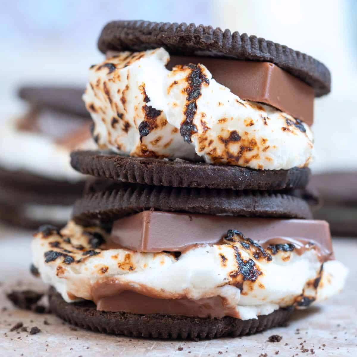 Chocolate and marshmallows sandwhiched in oreos, made after reading these s'mores recipes