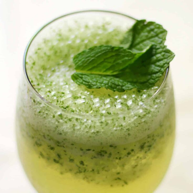 Non alcoholic green frosty coconut mint green tea mocktail drink