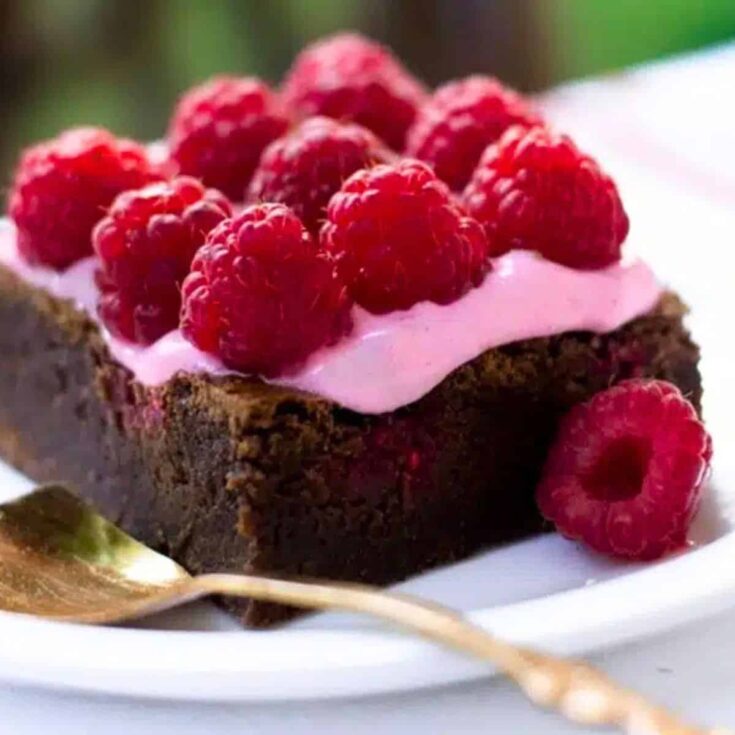 Raspberry brownie dessert with pink raspberry foam