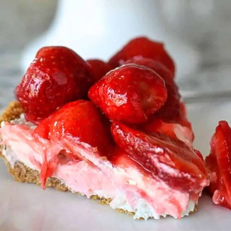 A slice of strawberry cheesecake pie