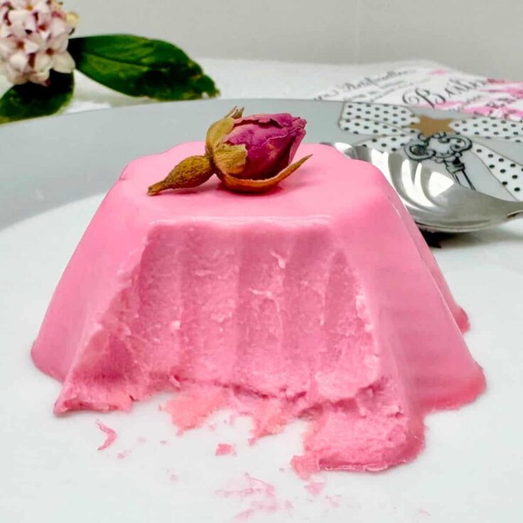 White chocolate panna cotta topped with a rose