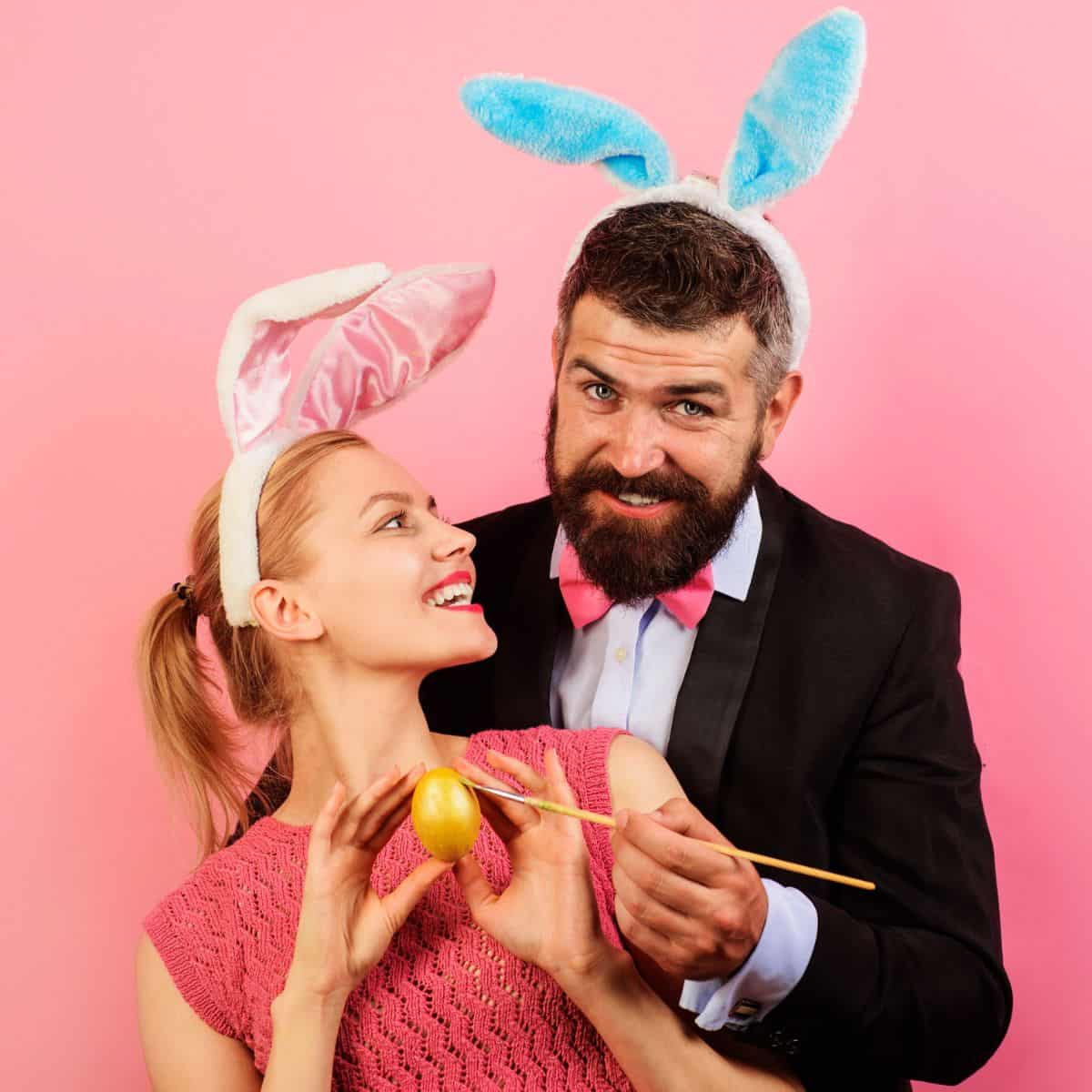 A couple wearing rabbit headbands, asking each other these Easter would you rather questions