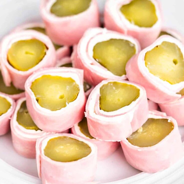 A plate of ham and pickle roll ups