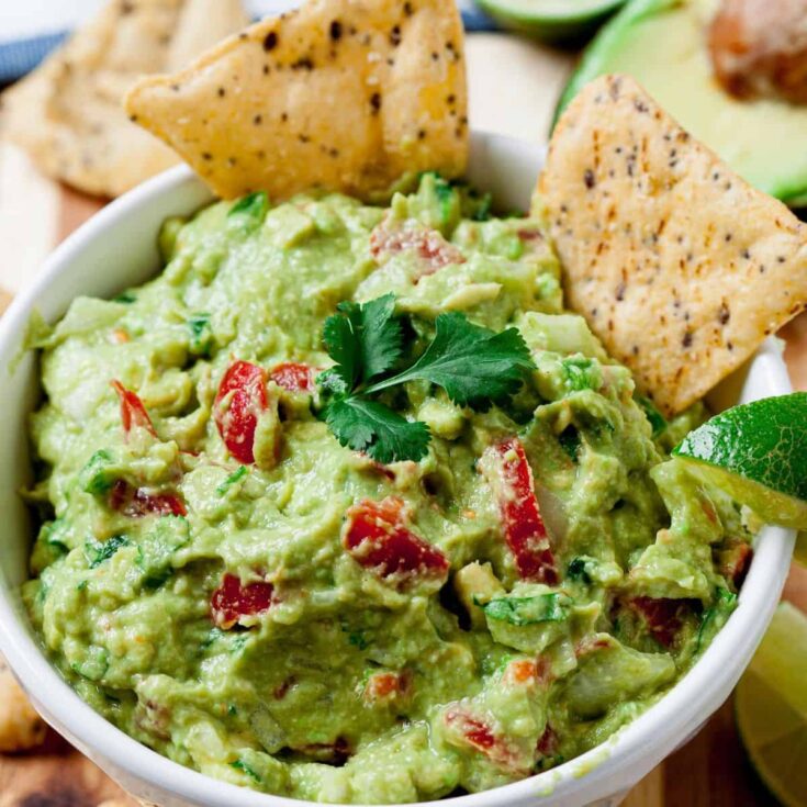 A bowl of guacamole green appetizer