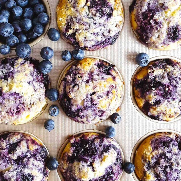 A tray of blueberry swirl muffins