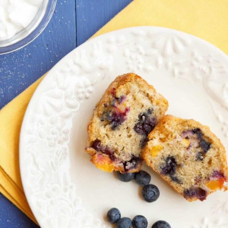 A plate of nectarine blueberry muffin