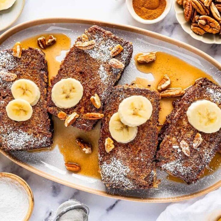 Banana bread French toast topped with sliced Bananas