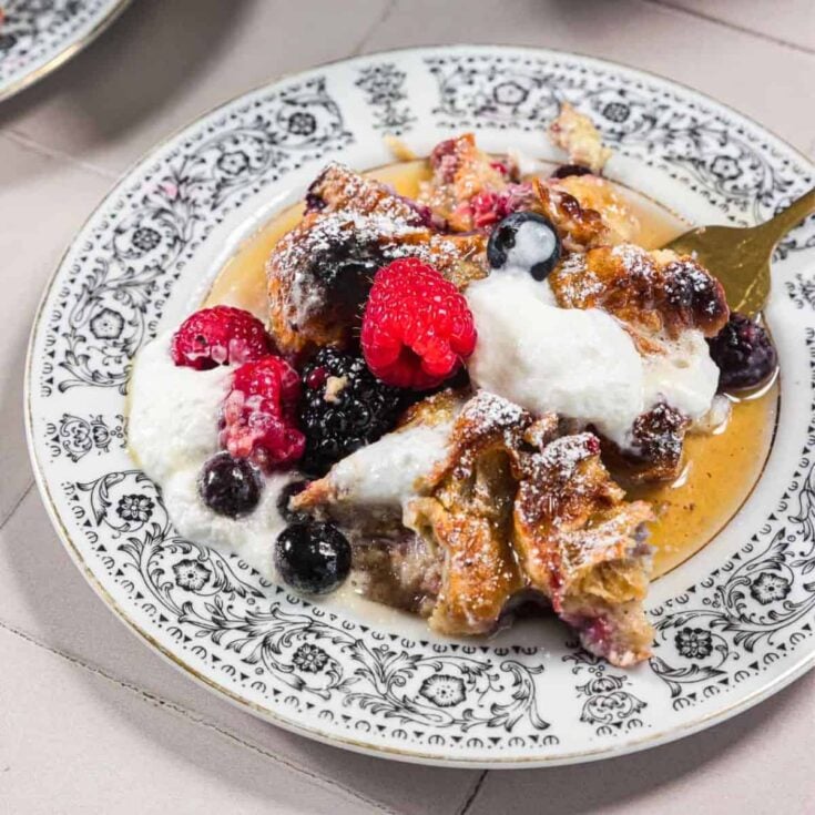 A plate of berry croissant French toast bake