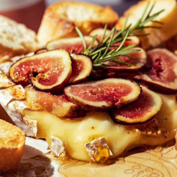 Baked brie with fig jam appetizer, made after reading these Fall dinner party recipes