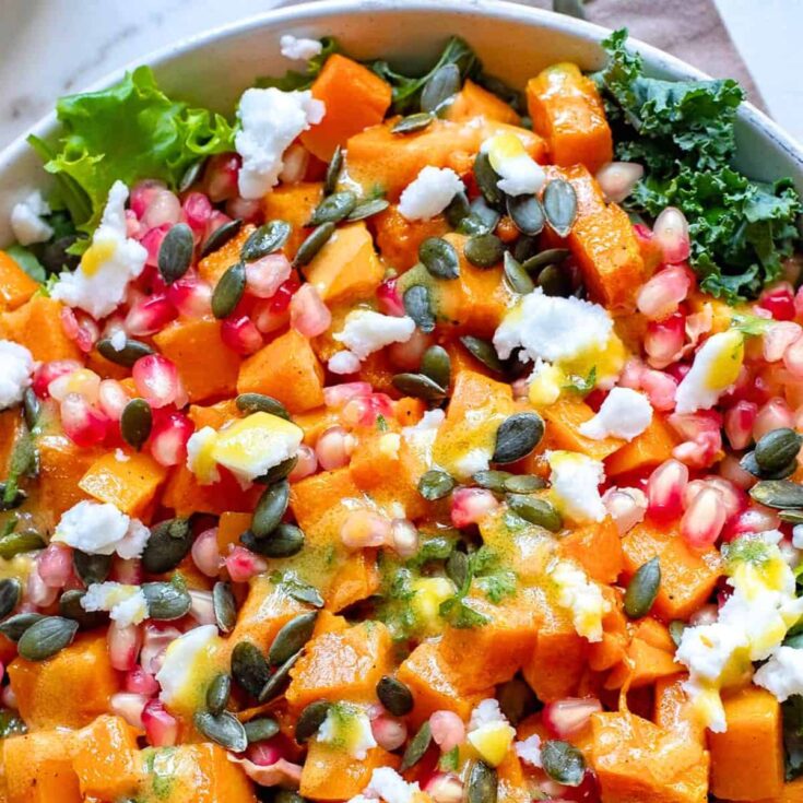 A bowl of butternut squash and pomegranate salad side, made after reading these Fall dinner party