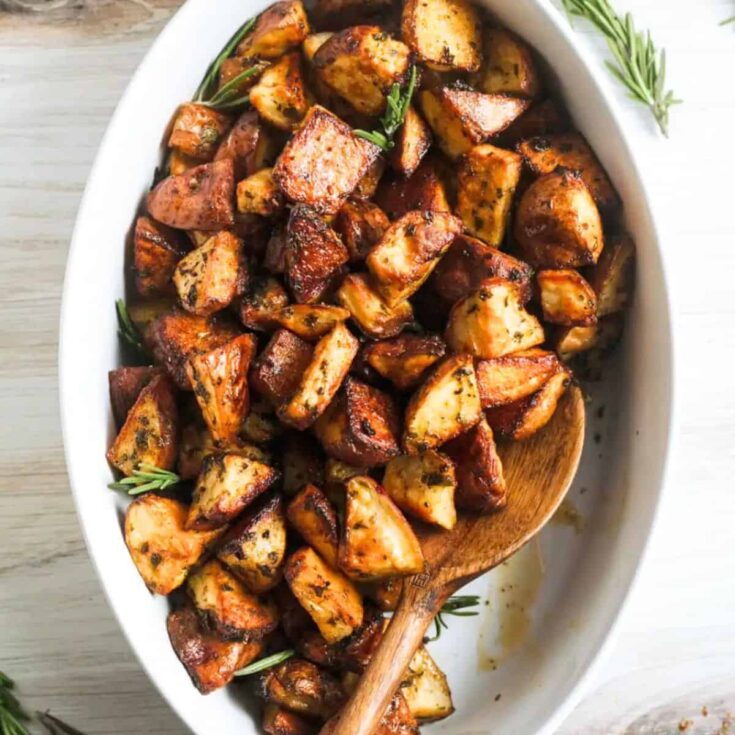 Garlic rosemary roasted potato side, with the text overlay Fall dinner party