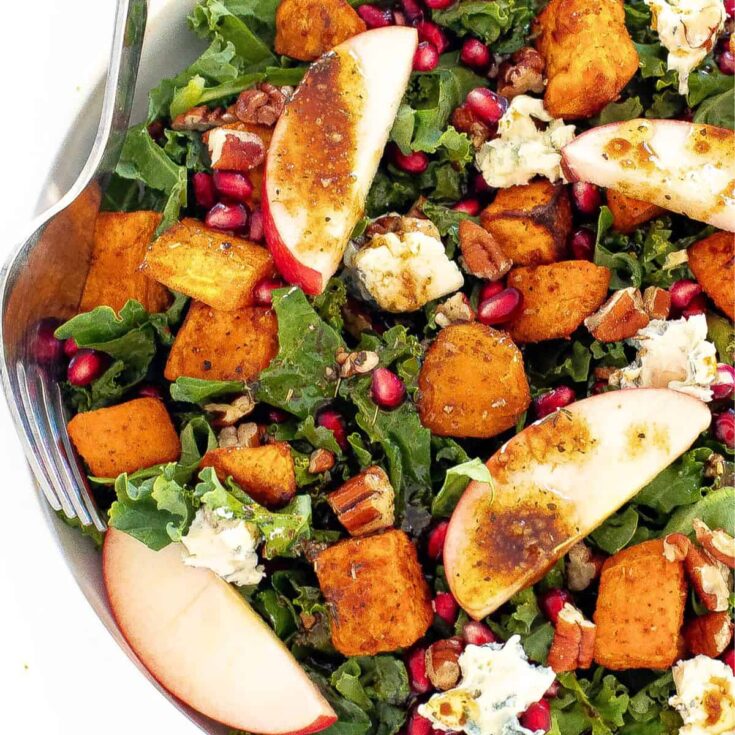A bowl of harvest salad side, with the text overlay Fall dinner party