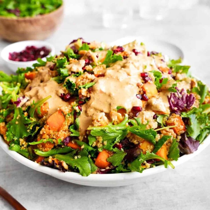 A bowl of roasted butternut squash quinoa salad side, made after reading these Fall dinner party